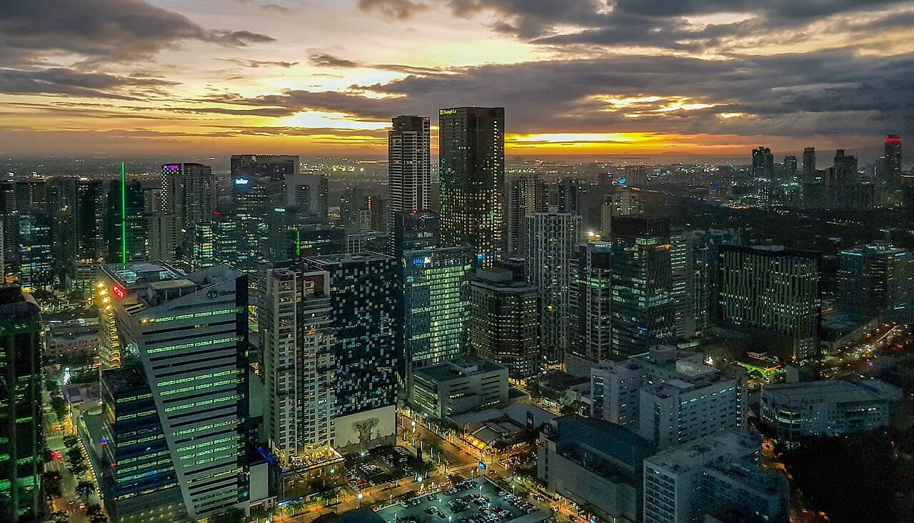 Bonifacio Global City and Makati skylines in Metro Manila at sunset